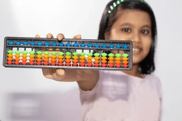 Child using an abacus for math learning