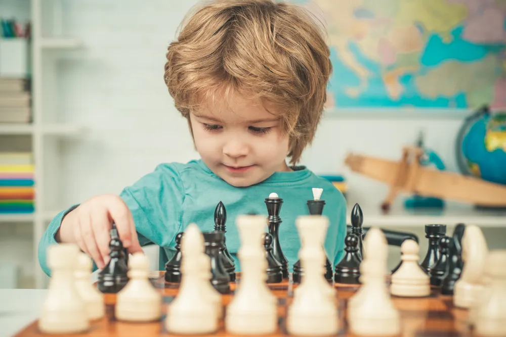 Students concentrating on a chess game